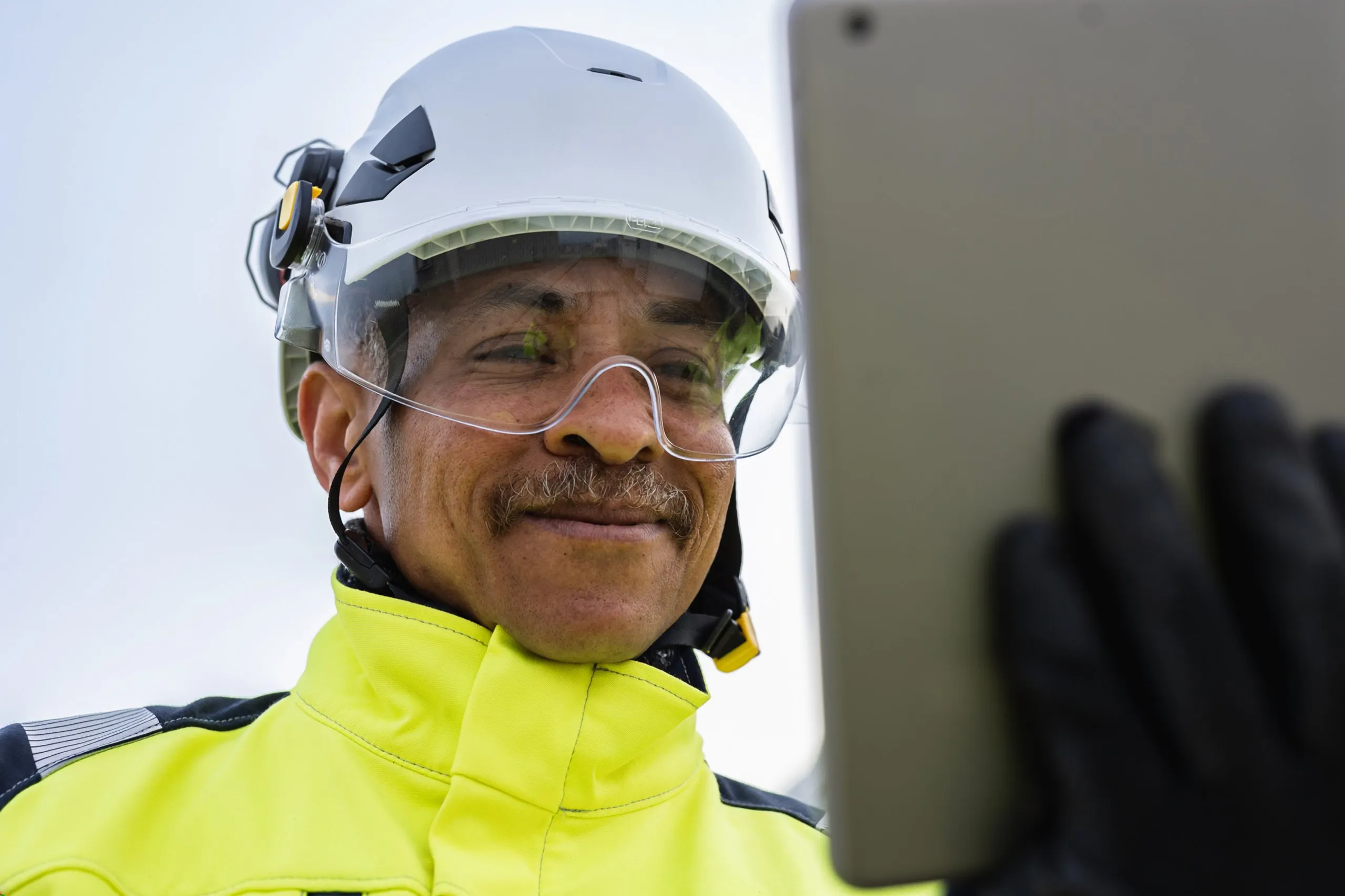 Technician holding tablet.