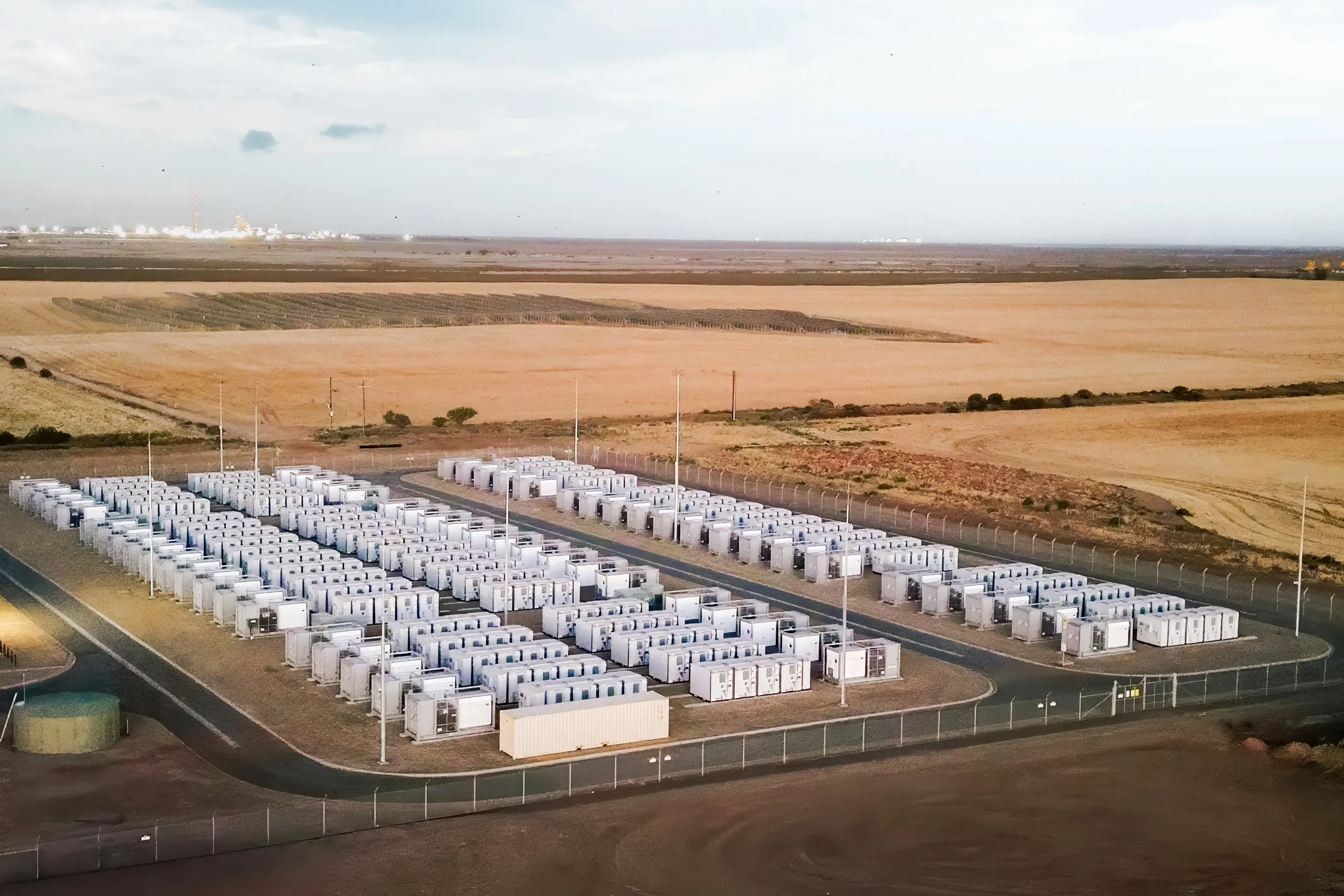 Aerial view of a battery energy storage facility in a desert landscape.