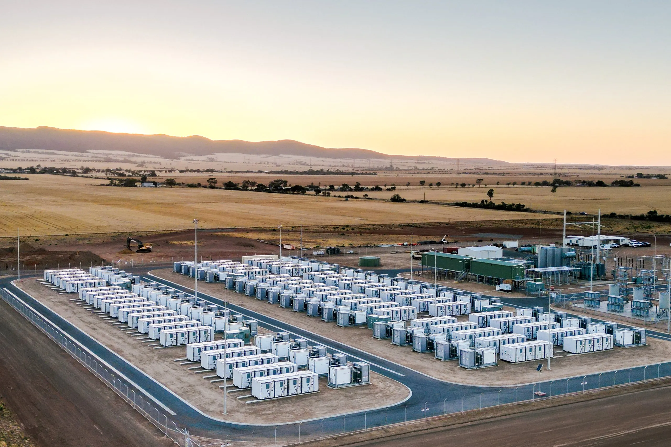 Aerial view of a battery energy storage facility in a desert landscape.